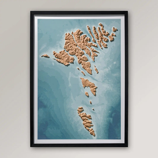 Framed 3D topographic map of the Faroe Islands inside a black frame on a light grey wall – TerraFrames