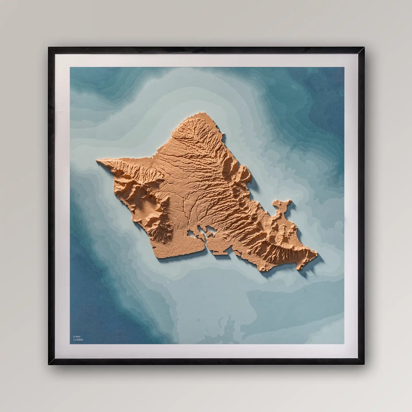 Framed 3D topographic map of O'ahu (Oahu), 40x40cm art board inside a black frame on a light grey wall – TerraFrames