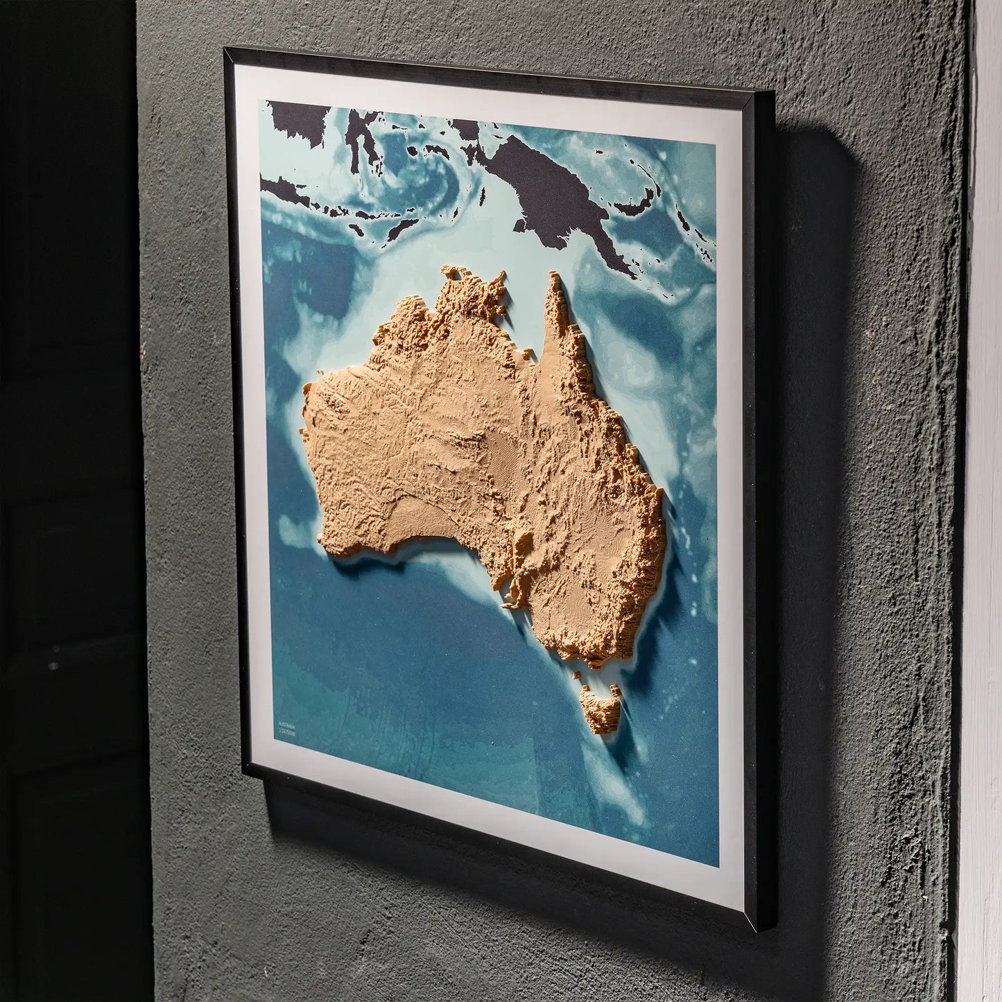 3D  topographic map of Australia in black frame, wall display – TerraFrames
